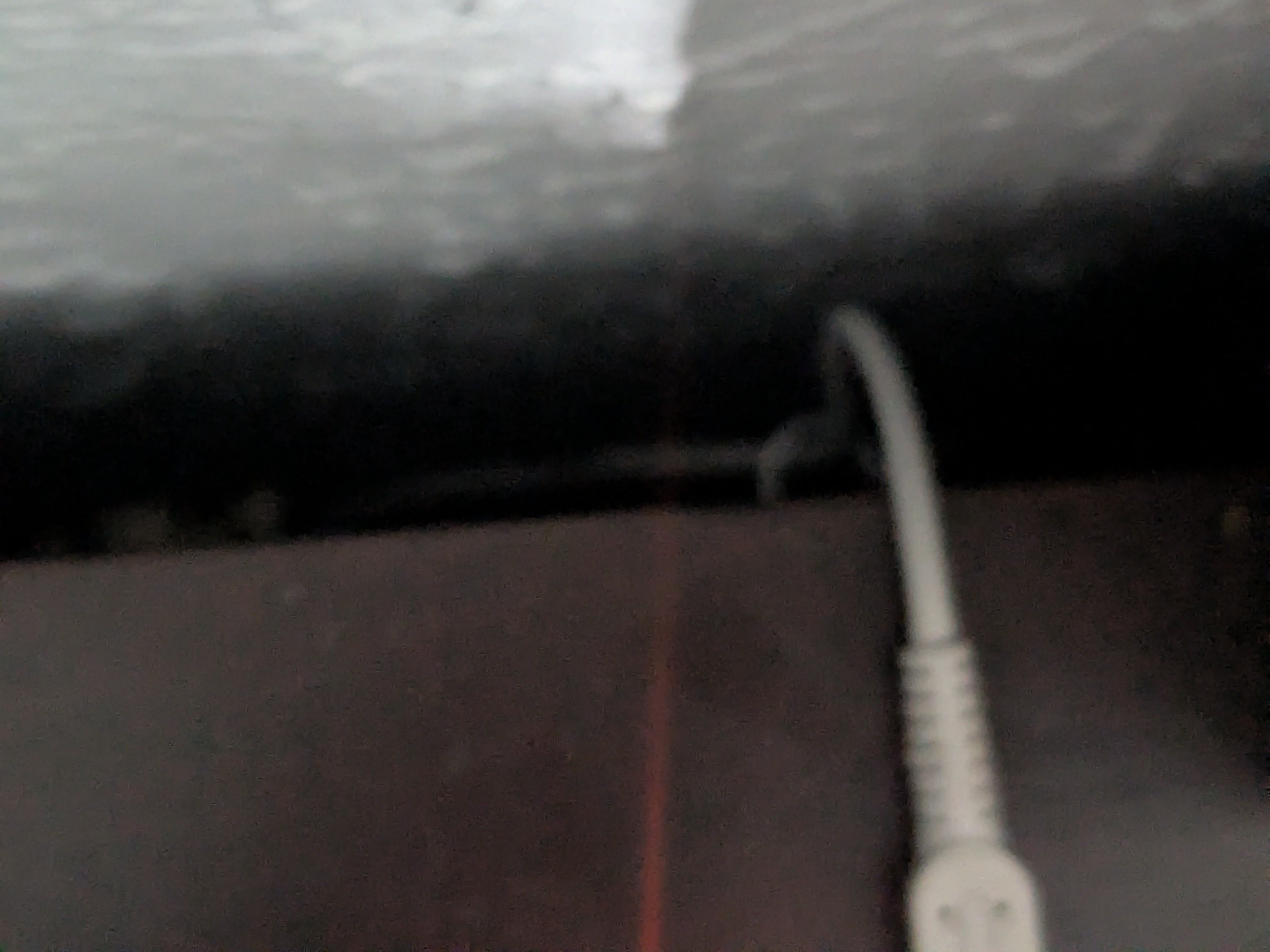 Close-up of the DSi's cable being held by a cord strip