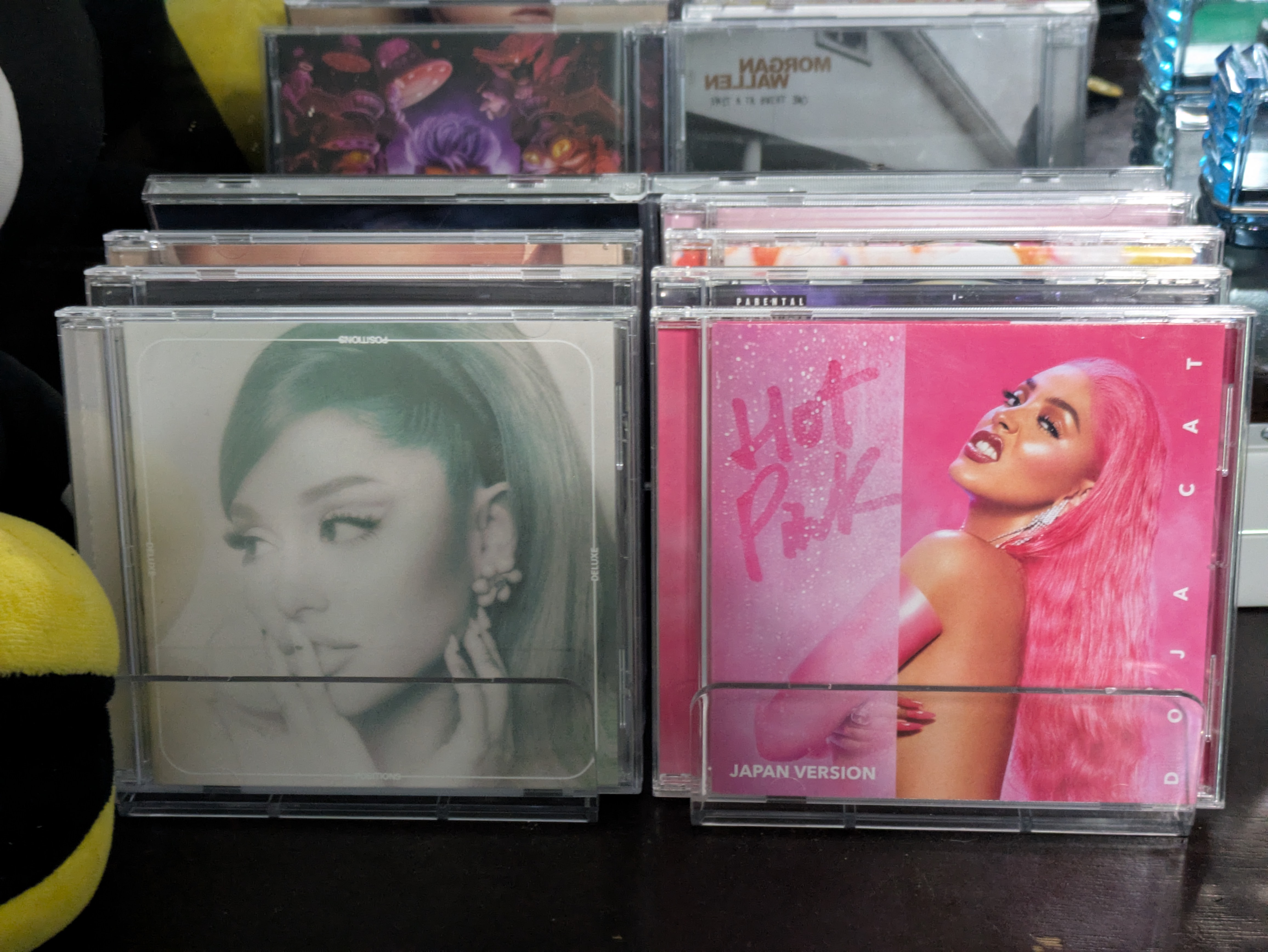 Music jewel cases displayed using a stand